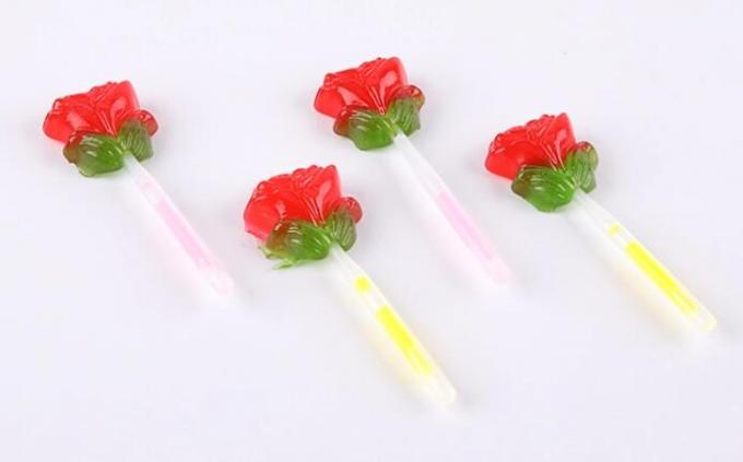 Fluoreszenz leuchten Süßigkeits-Rosen-Blumen-Form-Lutscher mit Beleuchtungs-Stock